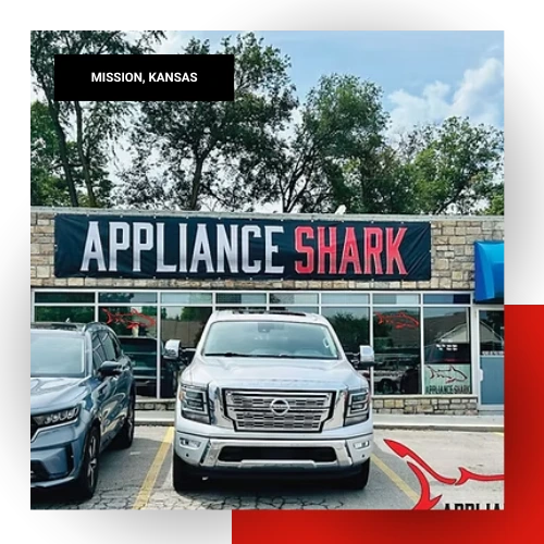 Appliance Shark store exterior with large branded sign and service vehicles parked in front in Mission, Kansas