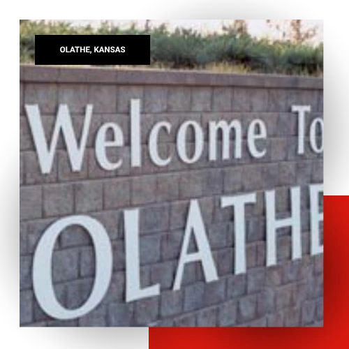 Stone monument welcome sign reading Welcome to Olathe in Olathe, Kansas