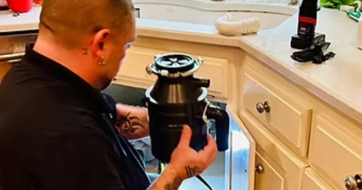 Garbage Disposal Is Humming but Not Working, technician installing disposal unit